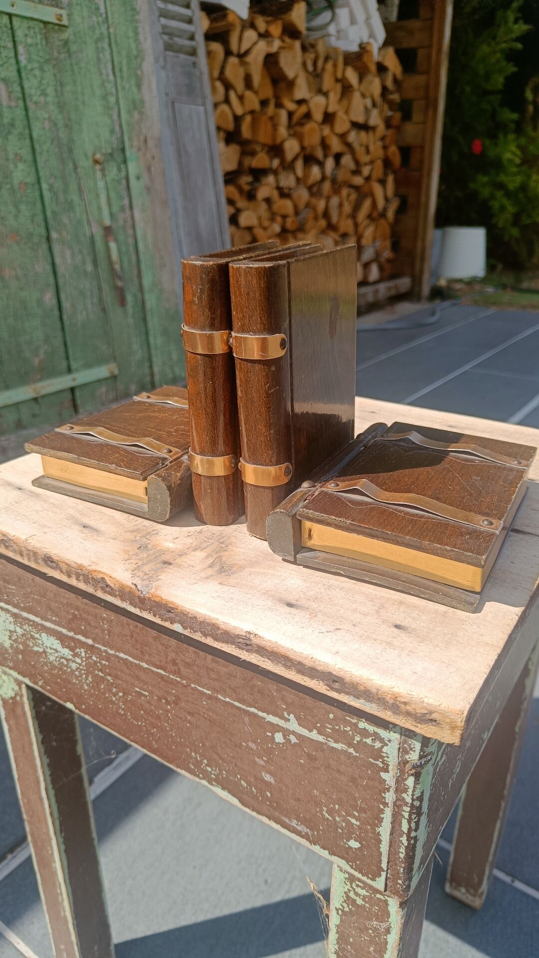 Wooden trompe-l'œil bookends with a book and box