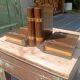 Wooden trompe-l'œil bookends with a book and box