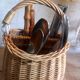 Covered rattan basket for lunch on 50s grass