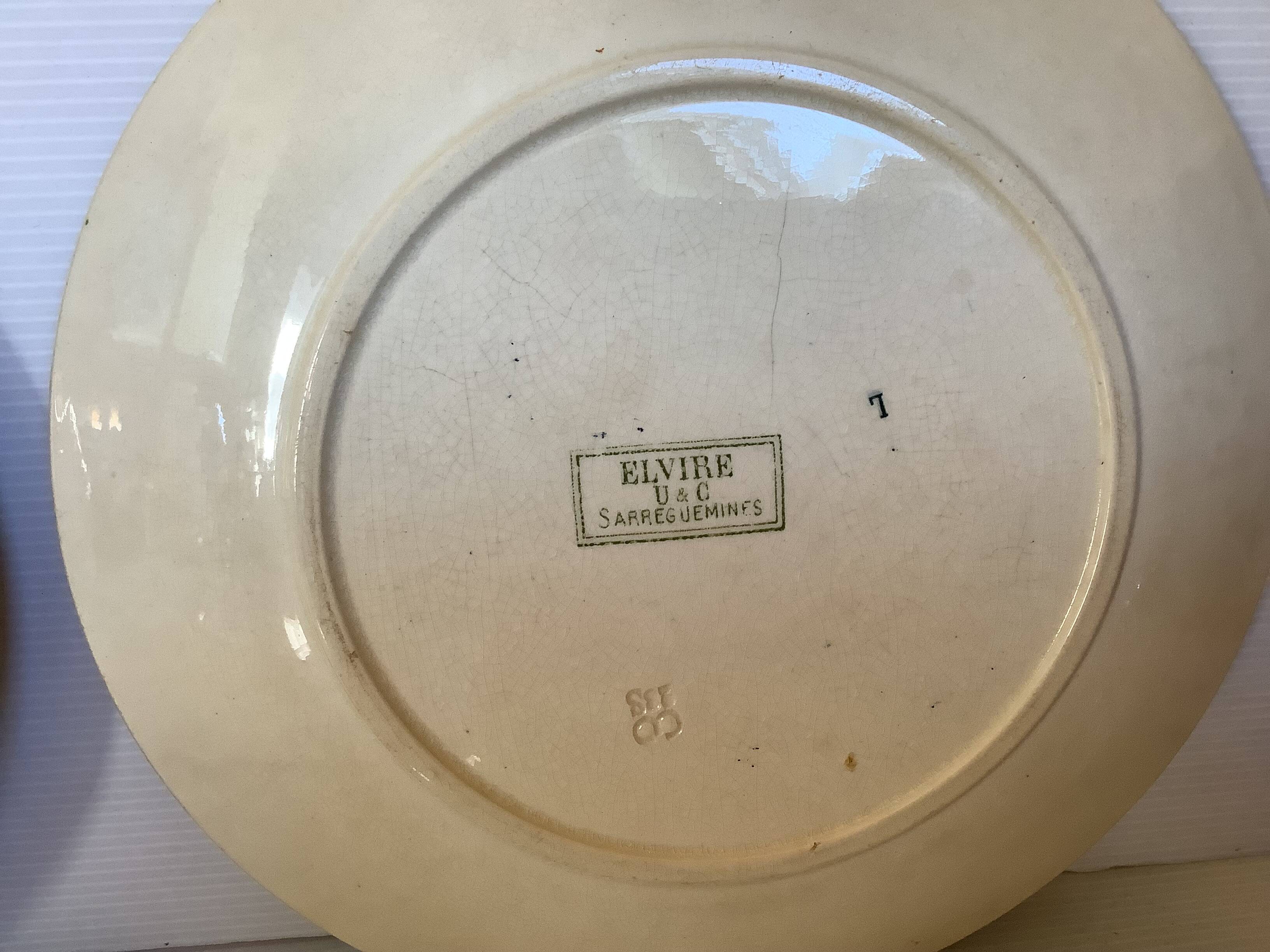 Four old earthenware plates