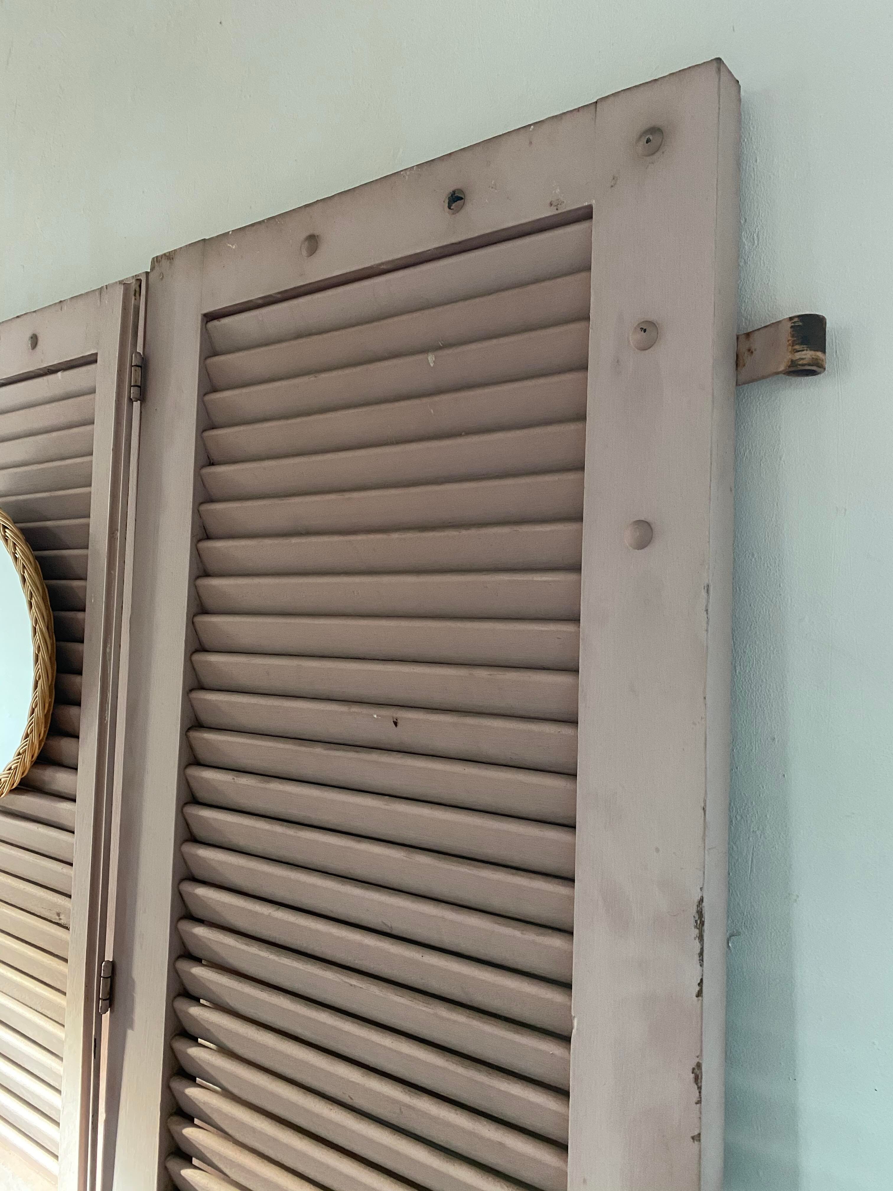 Pair of shutters with wooden shutters in old pink color