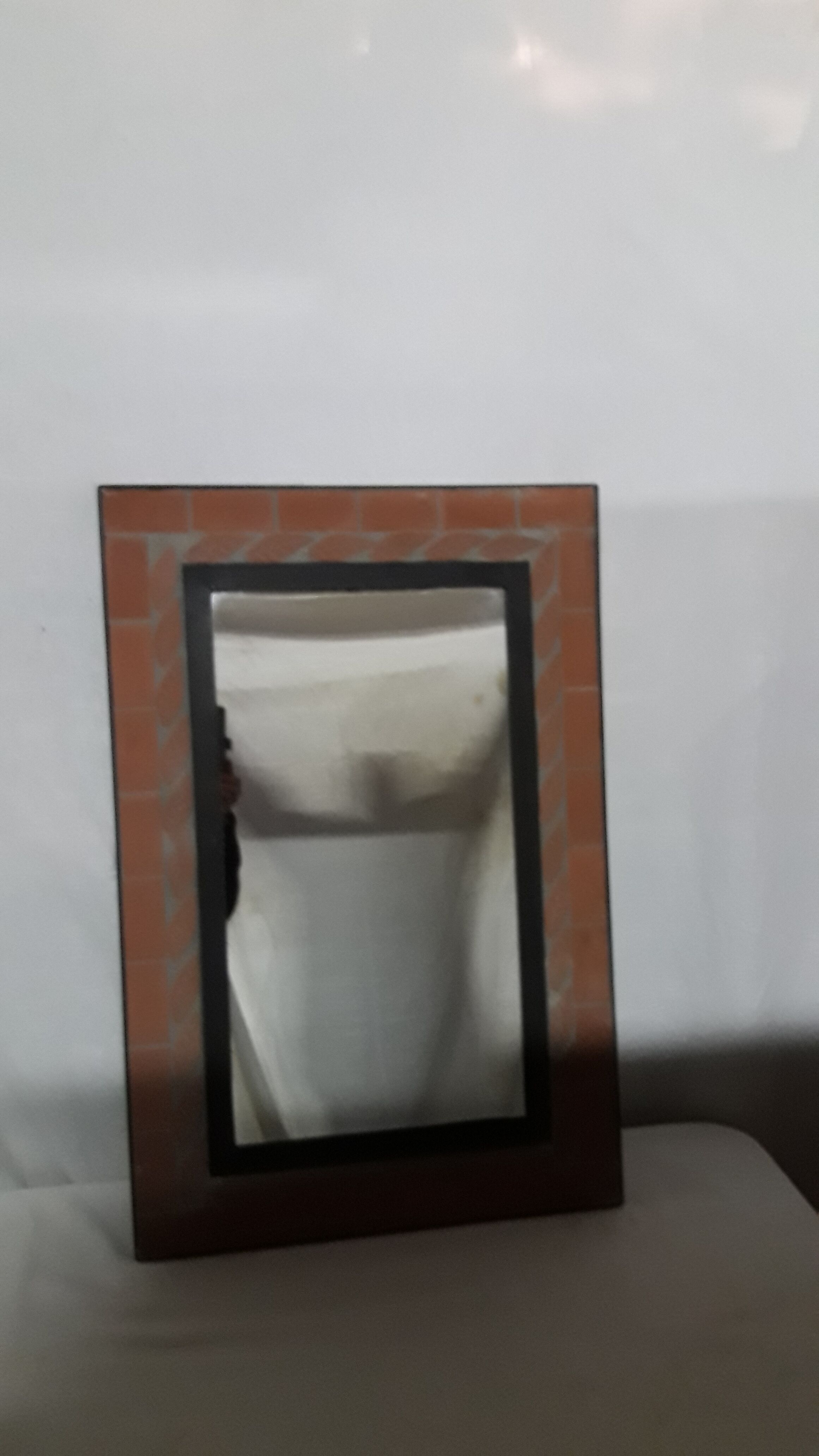 Mirror with terracotta frame