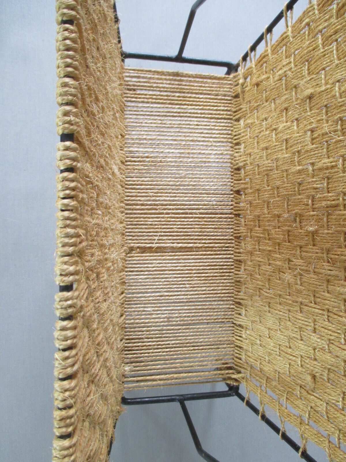 Rope and metal magazine holder