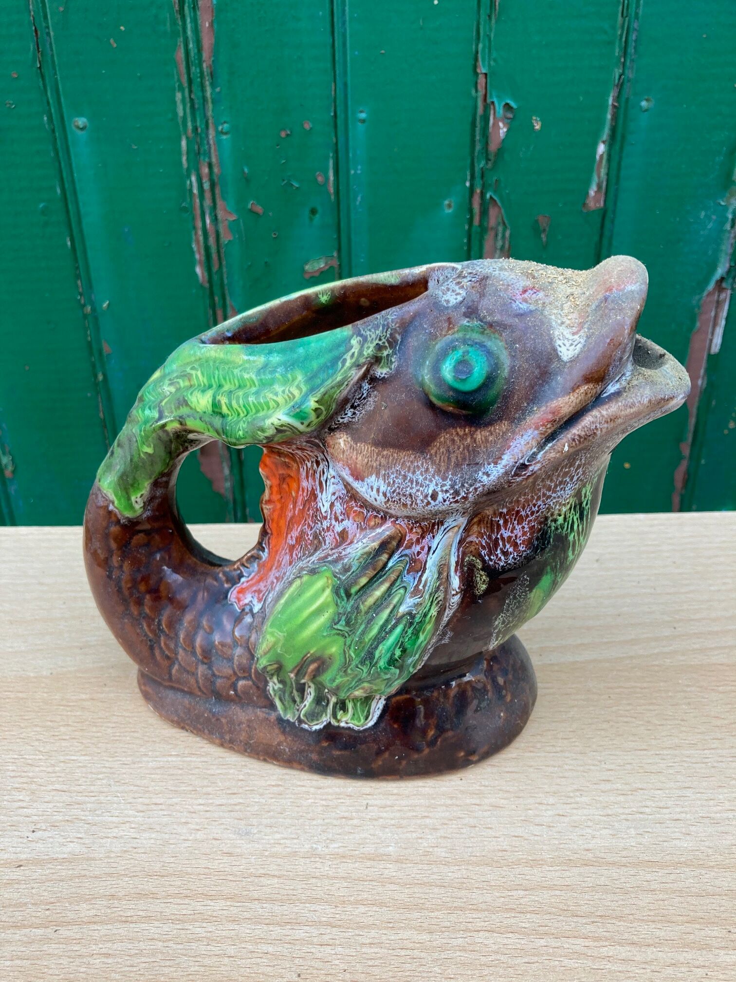 Glazed ceramic pitcher, fish