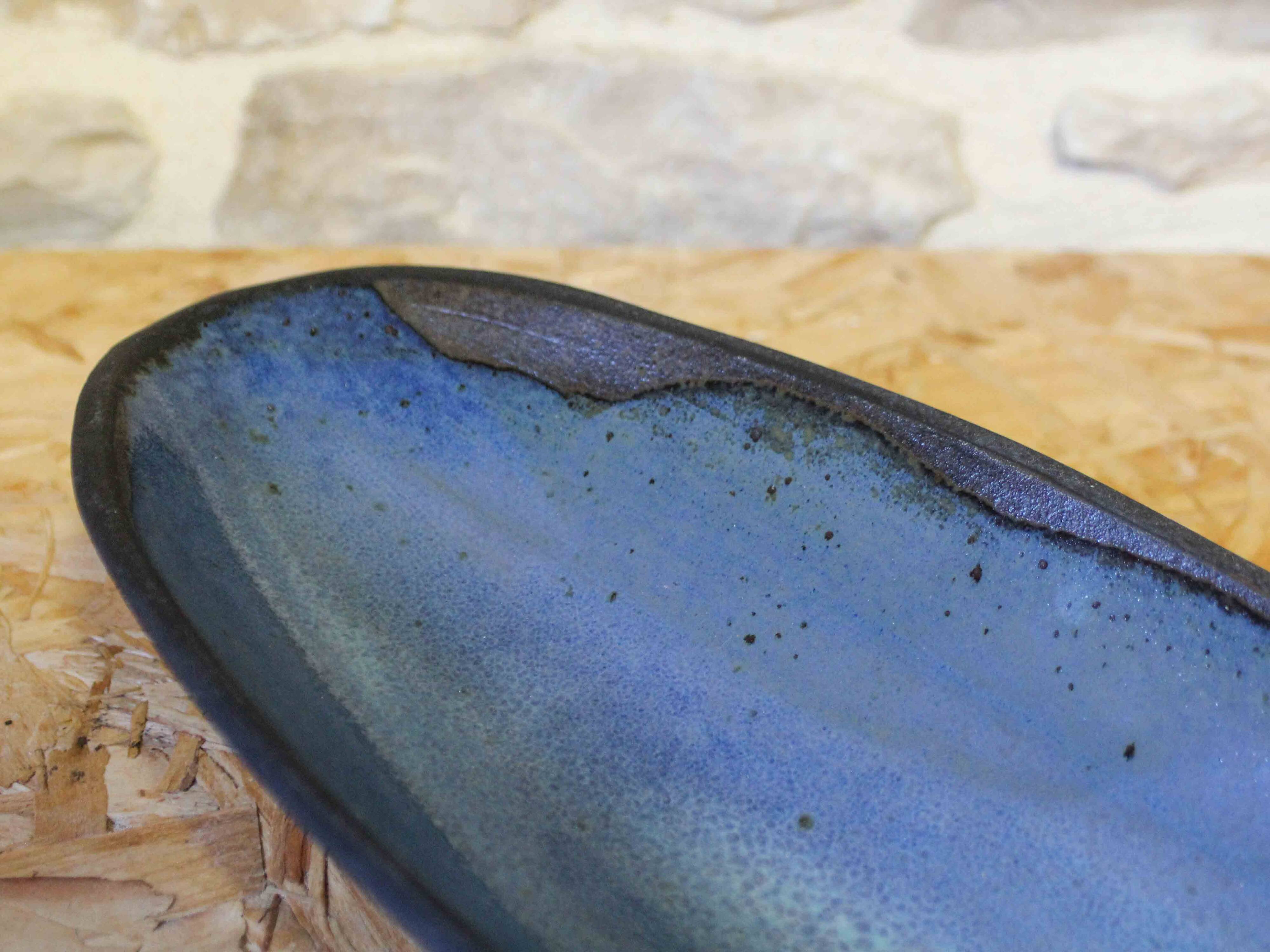 Blue glazed ceramic cup