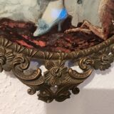 Italian oval frame in bronze and curved glass