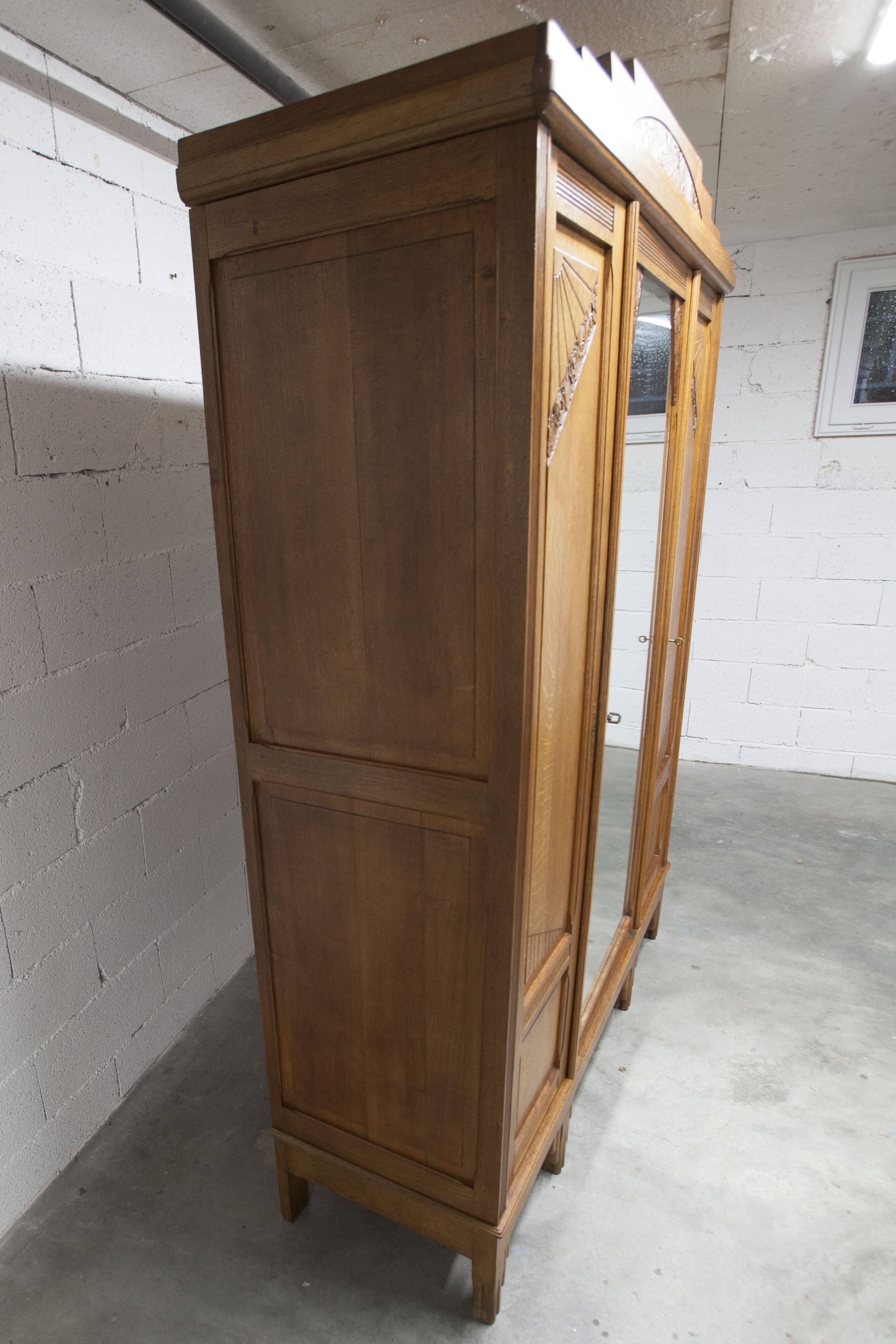Art Deco carved oak wardrobe - Flemish workshop circa 1930