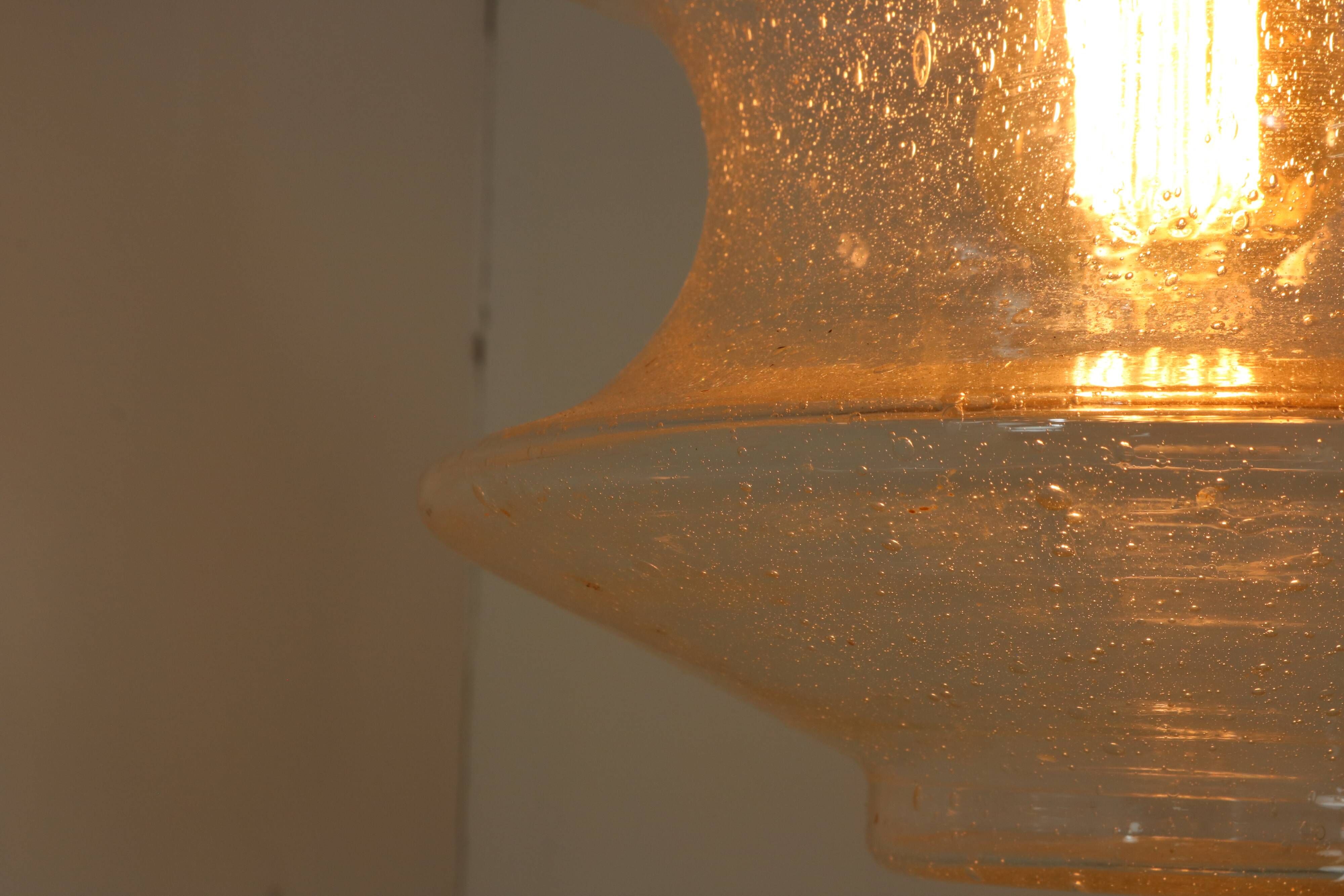 Set of two glass pendant lighting designed by Raak Holland
