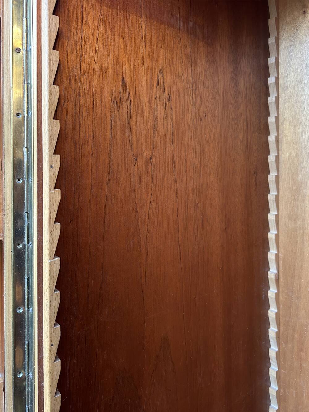 Mid-century wardrobe from the 1960s in wood, with a chevron front and tapered legs.