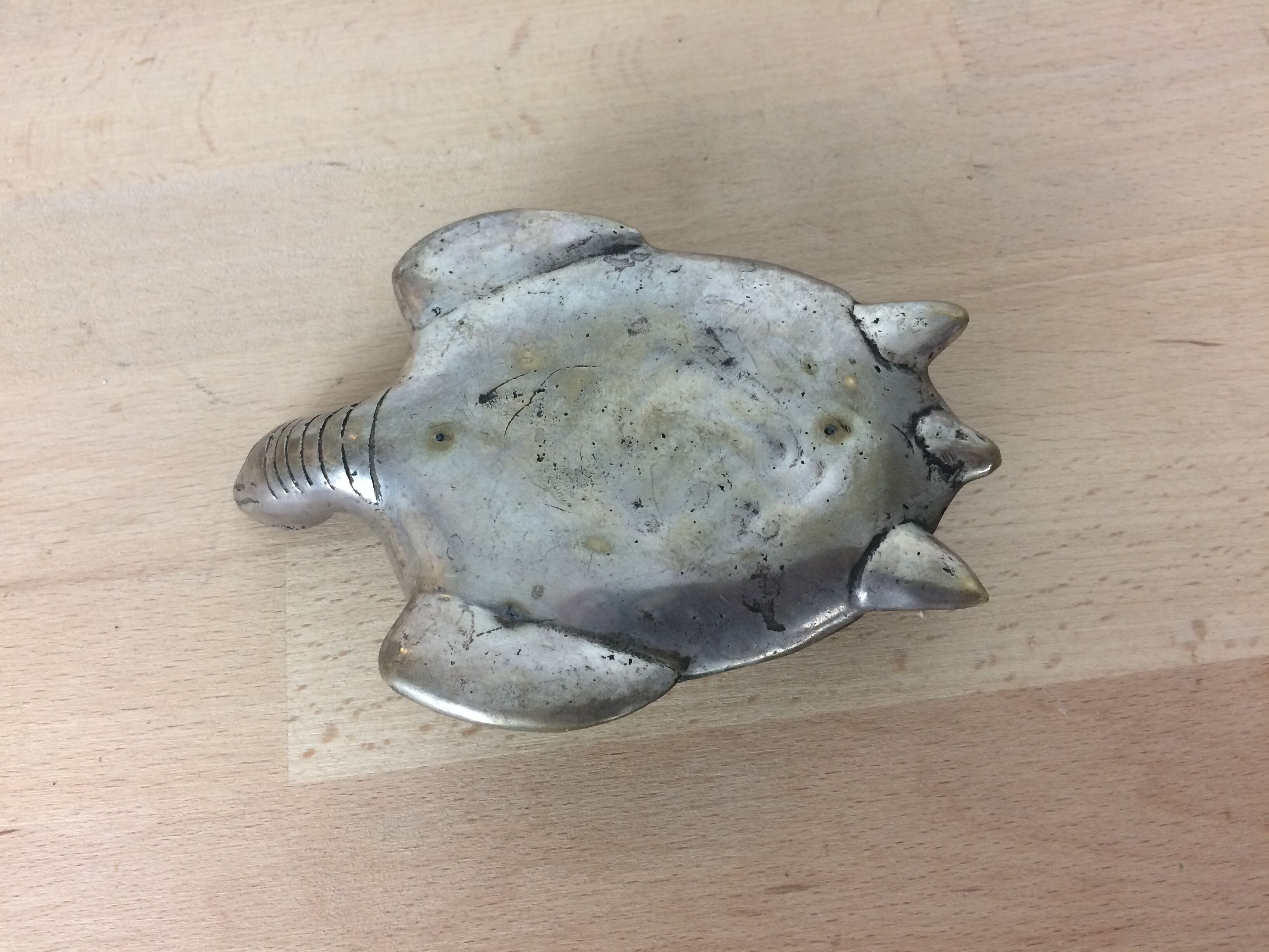 Turtle brass paper press