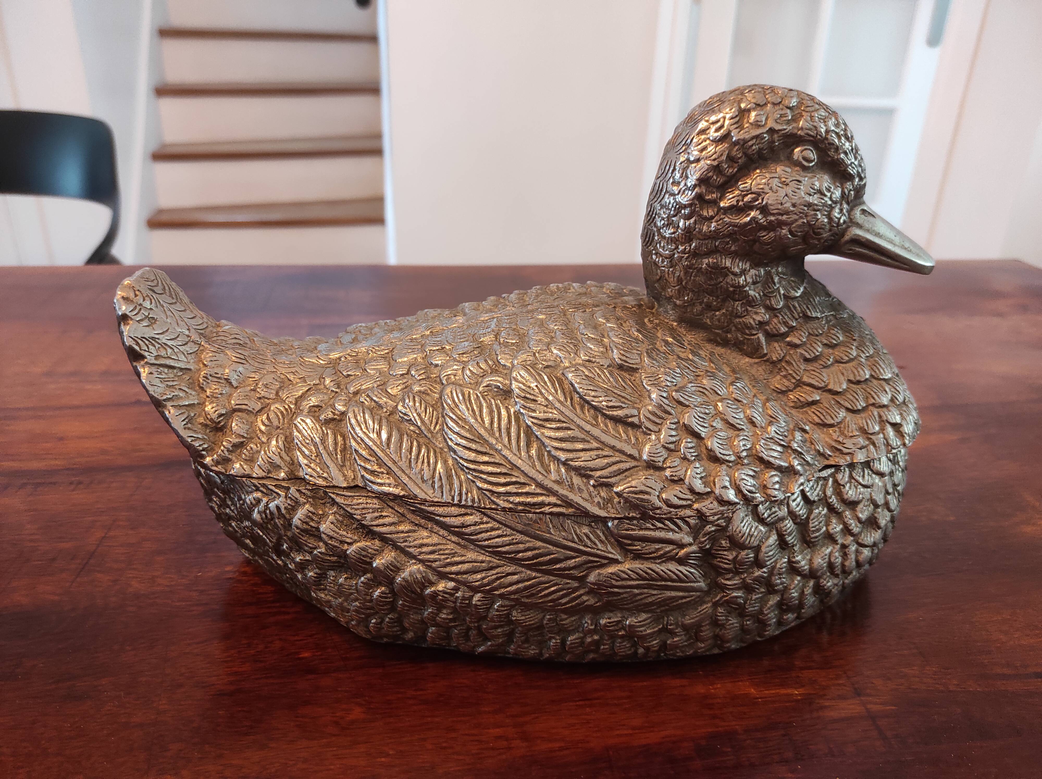 Large silver metal duck