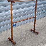Turned wooden towel rack
