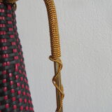 Red and black scoubidou bottle