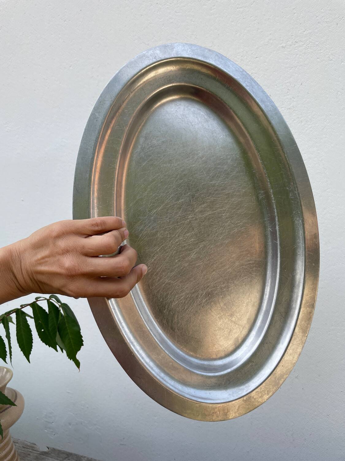 Oval stainless steel dish, signed Rémi Letang