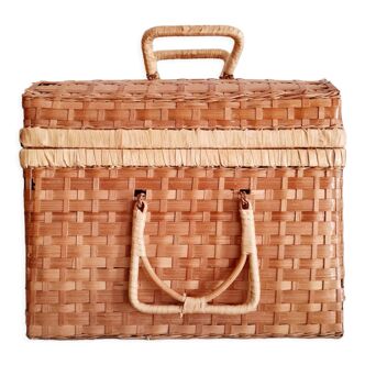 Small suitcase in vintage rattan trunk