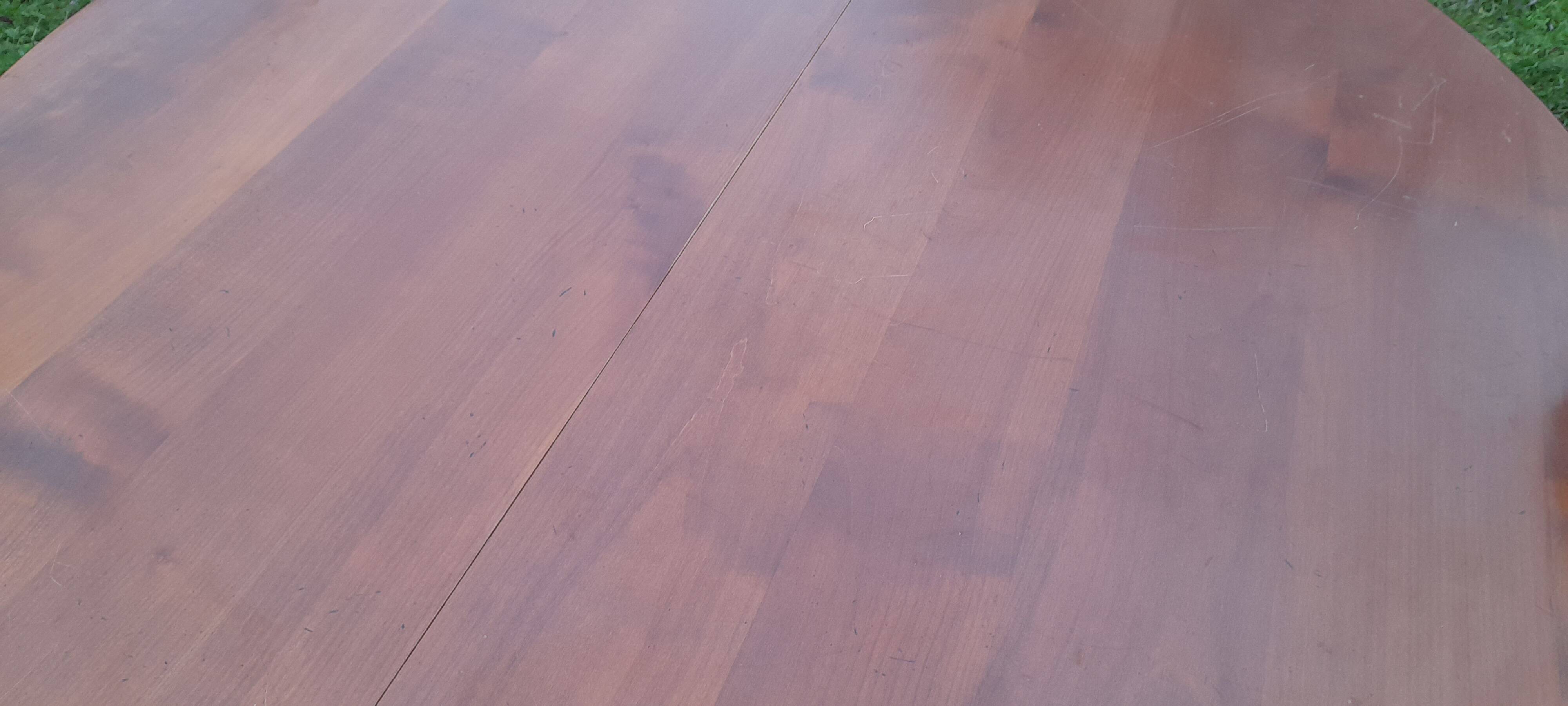 Round dining table in cherry-stained fruitwood with 2 extensions diam 110 cm