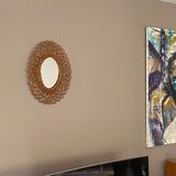 Sun mirror in woven rattan. 1960.