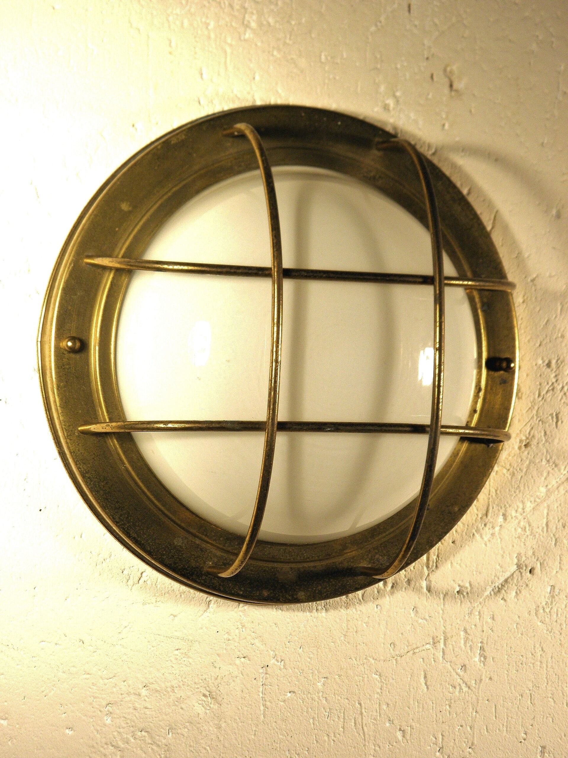 Brass "porthole" wall lamp