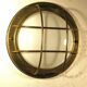 Brass "porthole" wall lamp
