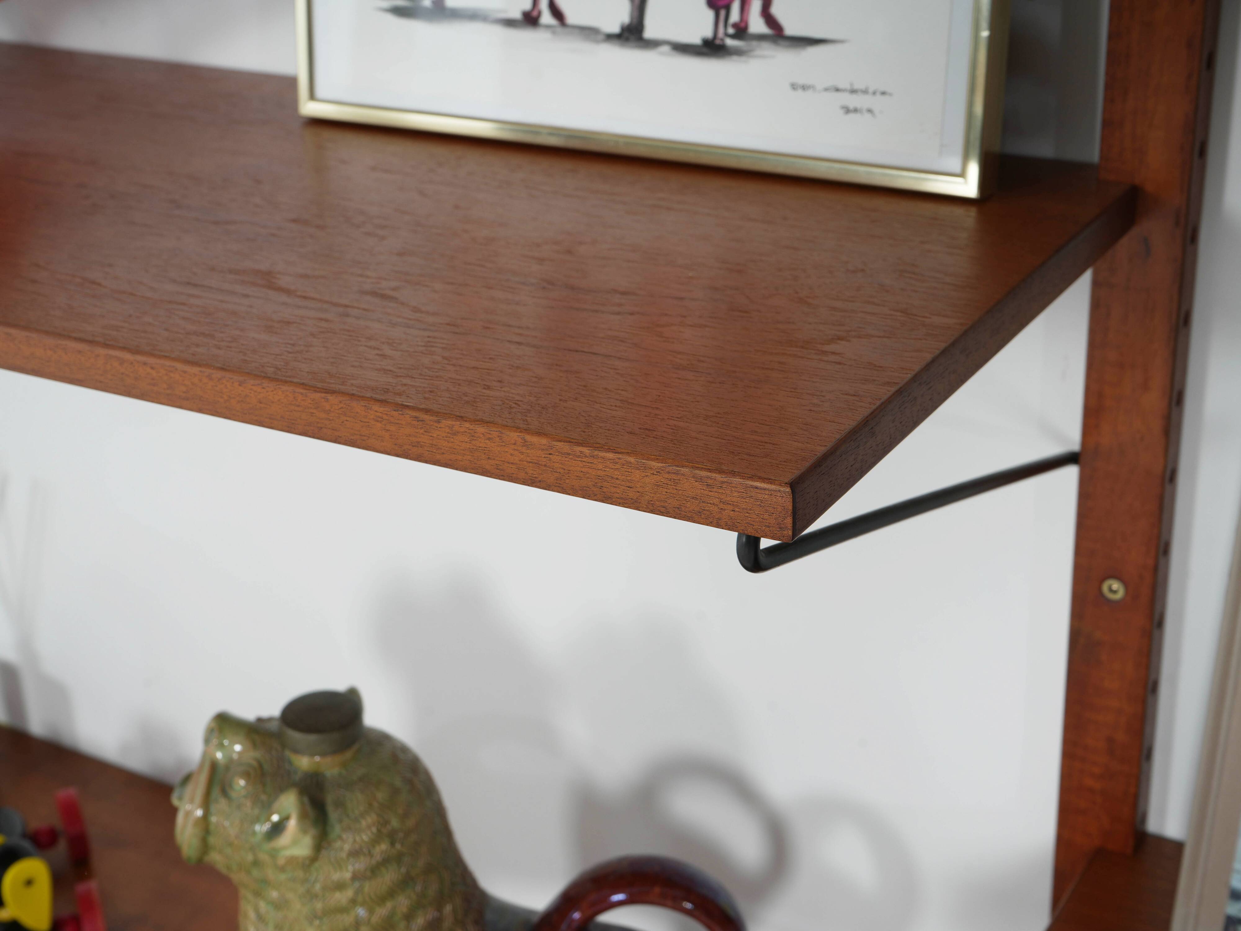 Modular shelving from the 1960s — Danish teak veneer wall system