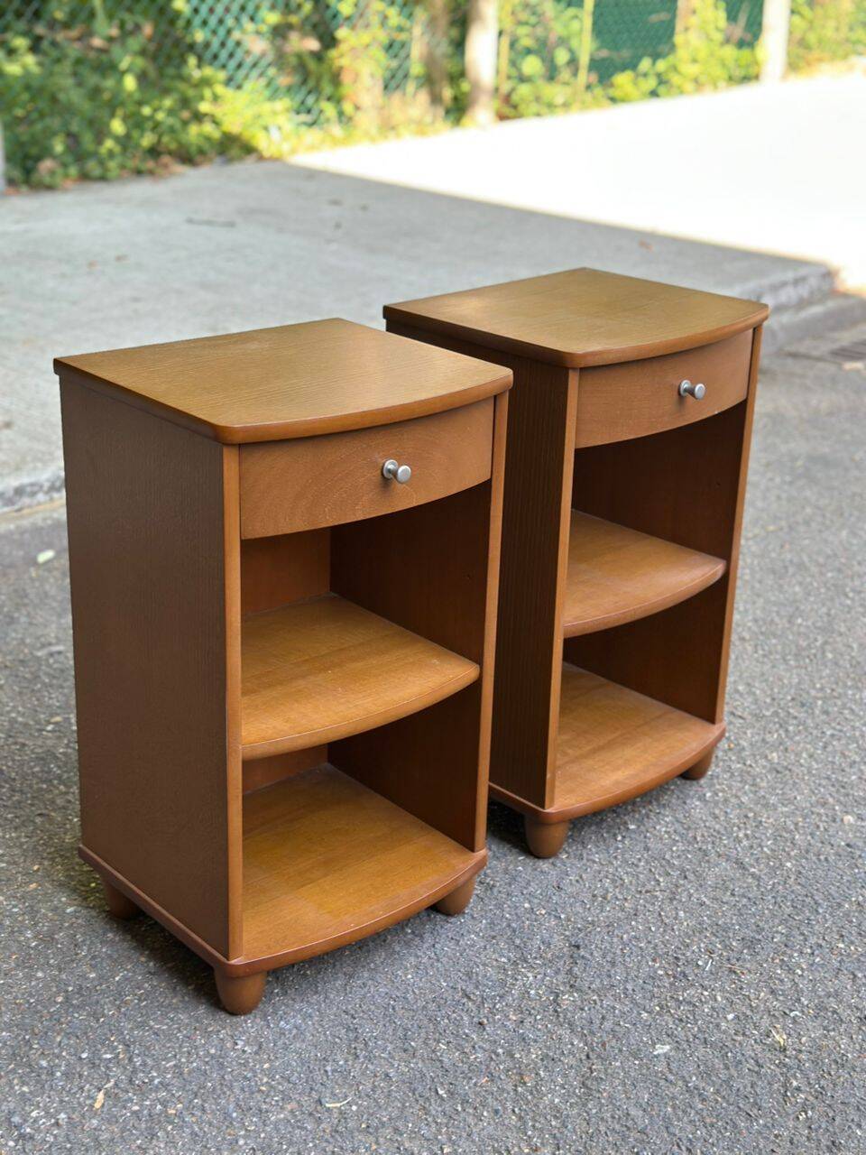 2 contemporary wooden bedside tables from the 2000s.