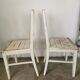 Set of 6 mismatched white chairs