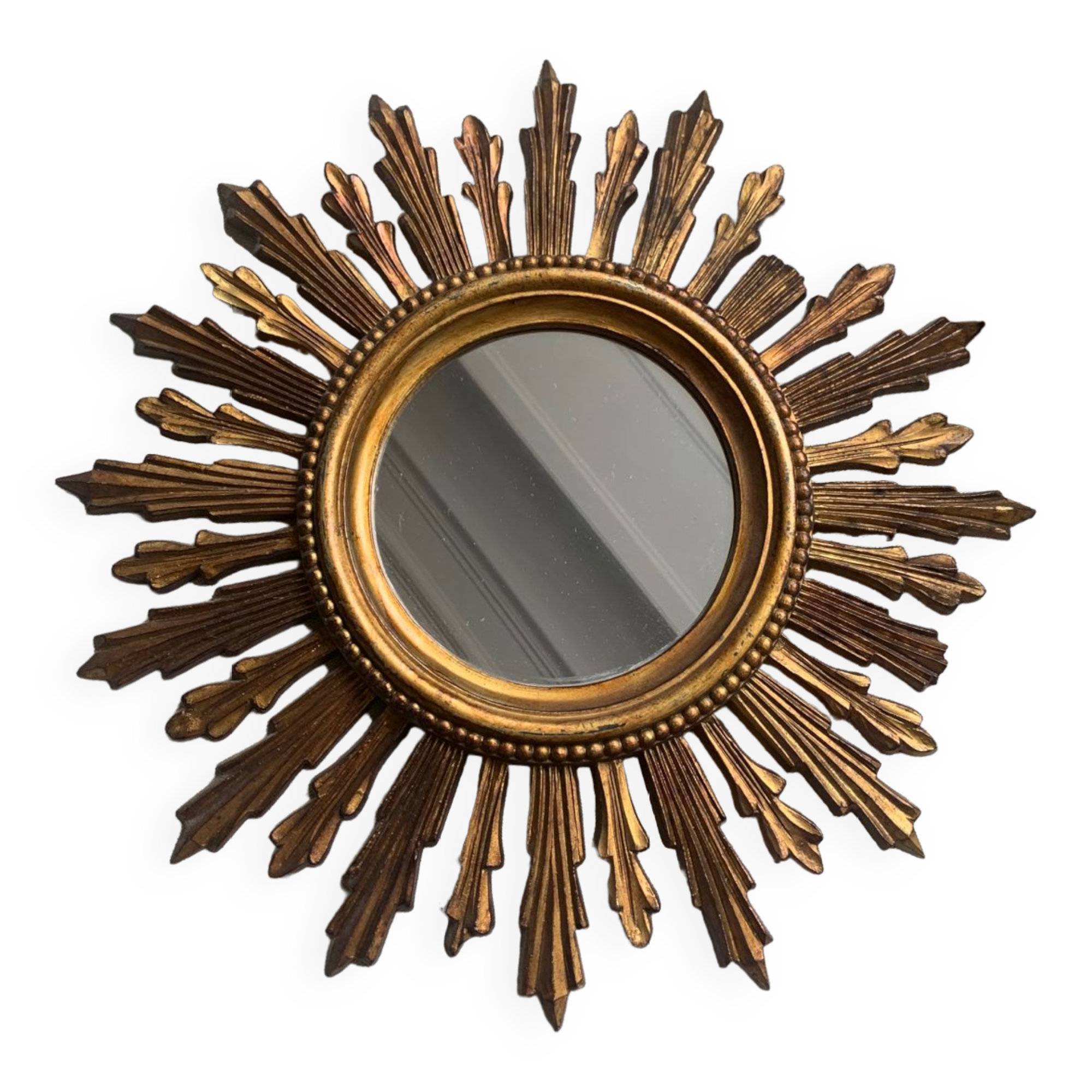 Sun mirror in old wood