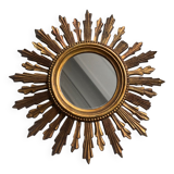 Sun mirror in old wood