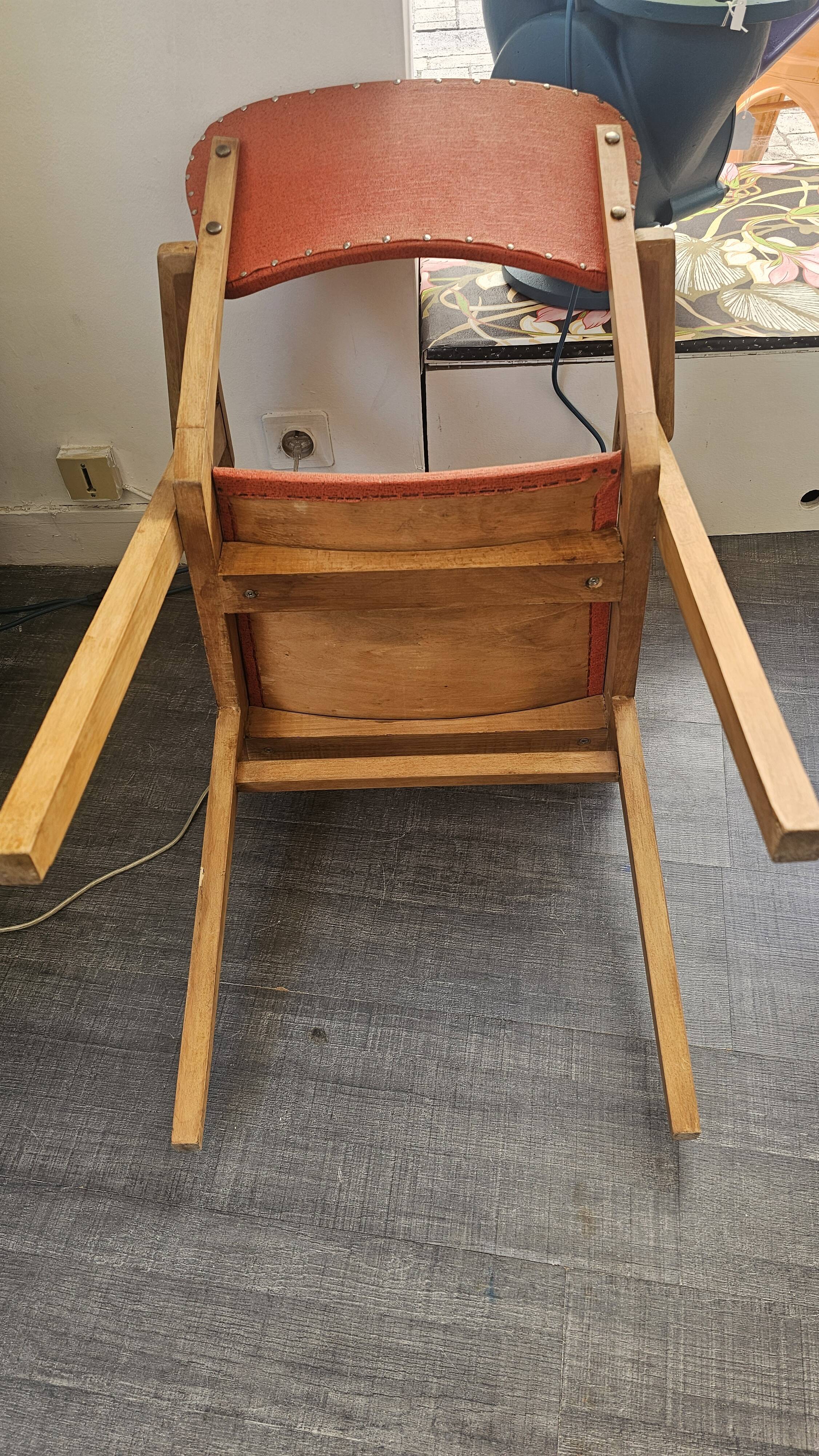 Modernist armchair in wood and orange fabric