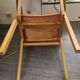 Modernist armchair in wood and orange fabric