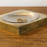 Picks up brass counter money