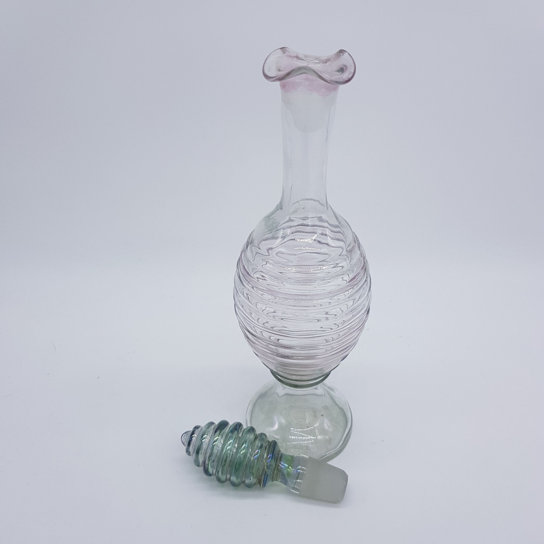 Old carafe ringed iridescent glass blown