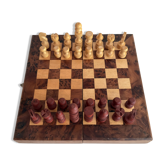 Old wooden chess set with a folding wooden box.