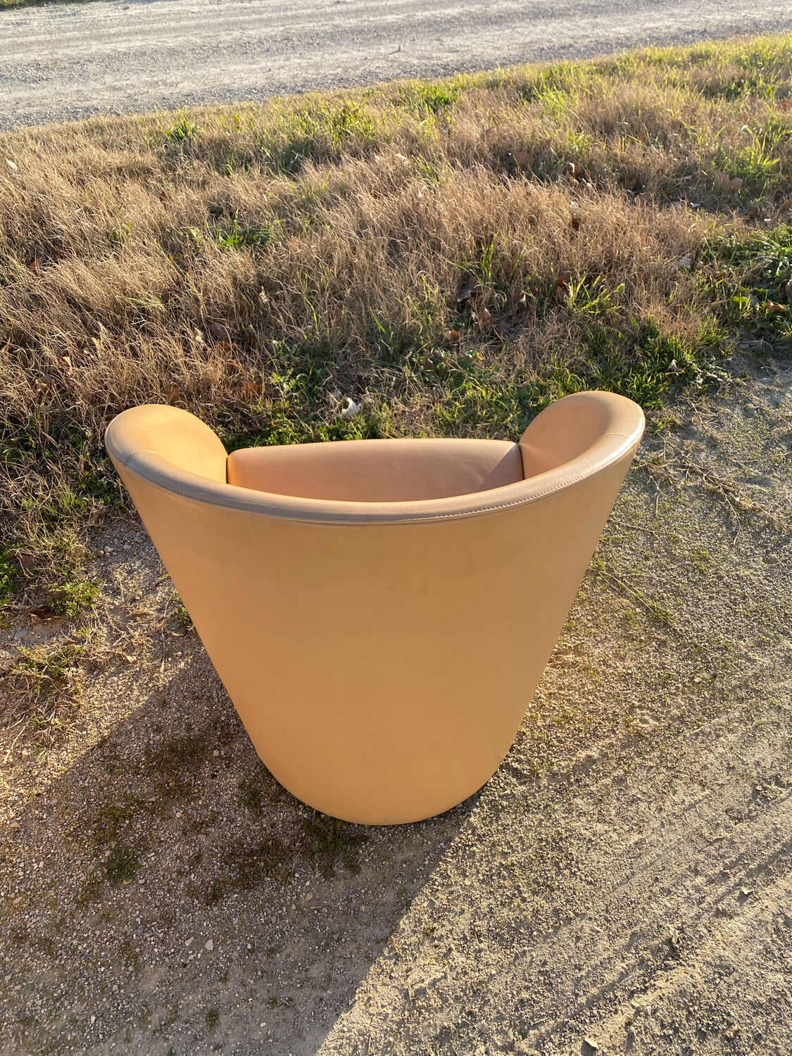 Pair of designer leather armchairs