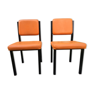 Vintage chairs in orange Skaï with black lacquered metal tubular base