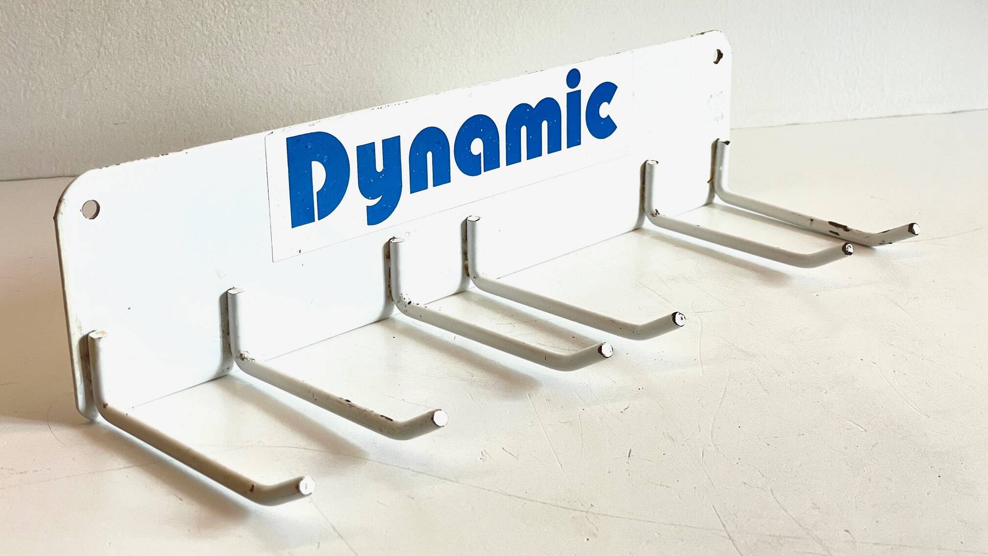 Vintage white metal wall trade coat rack
