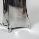 “Quadrilobe” lamp in polished metal. 1970s.