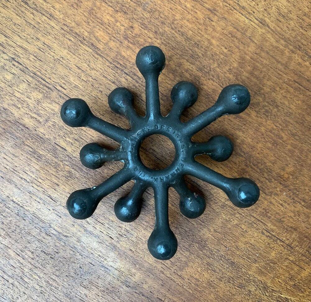 Brutalist Danish candle holder from the mid-century in cast iron by Jens H. Quistgaard.