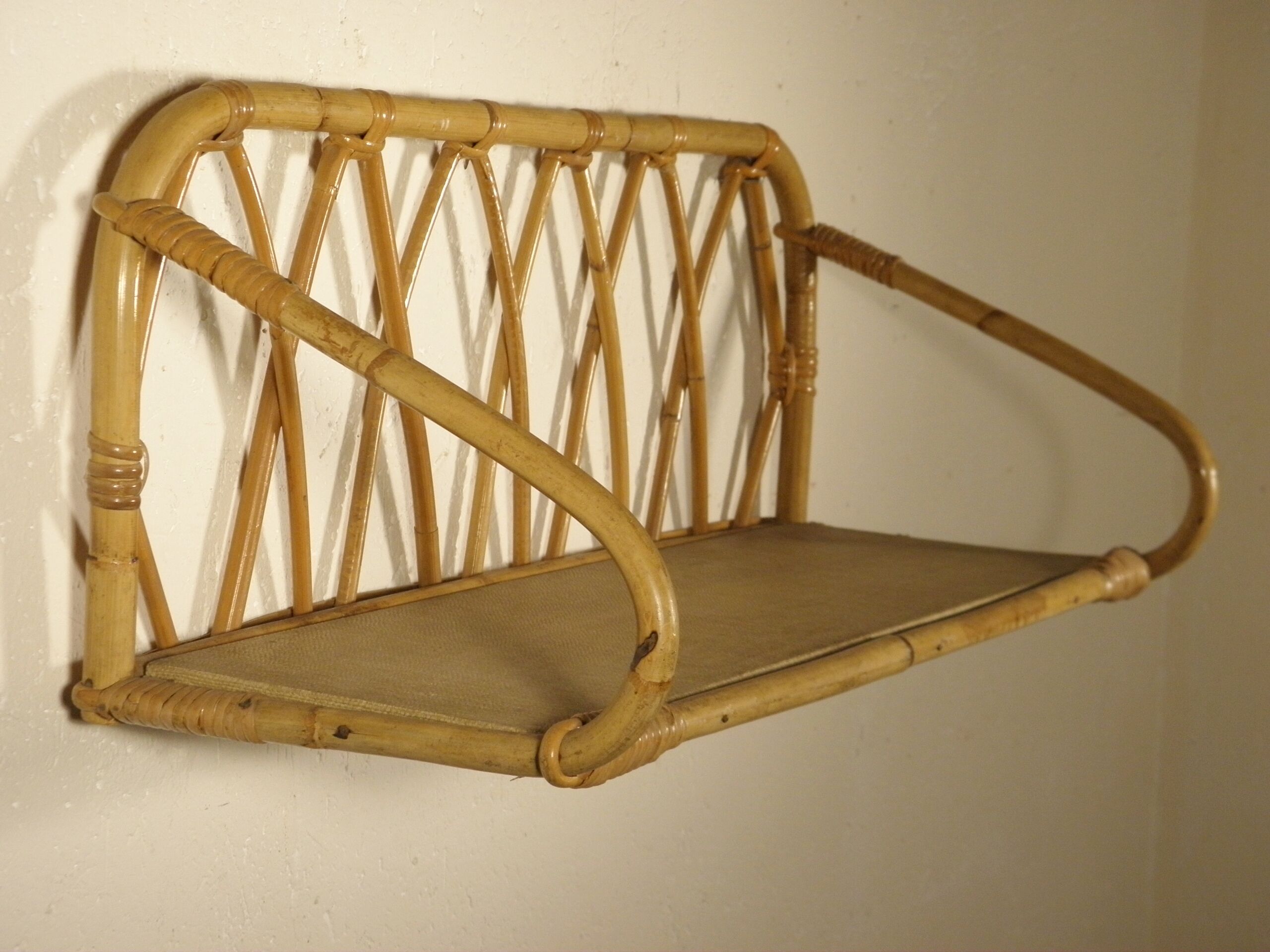 Rattan wall shelf