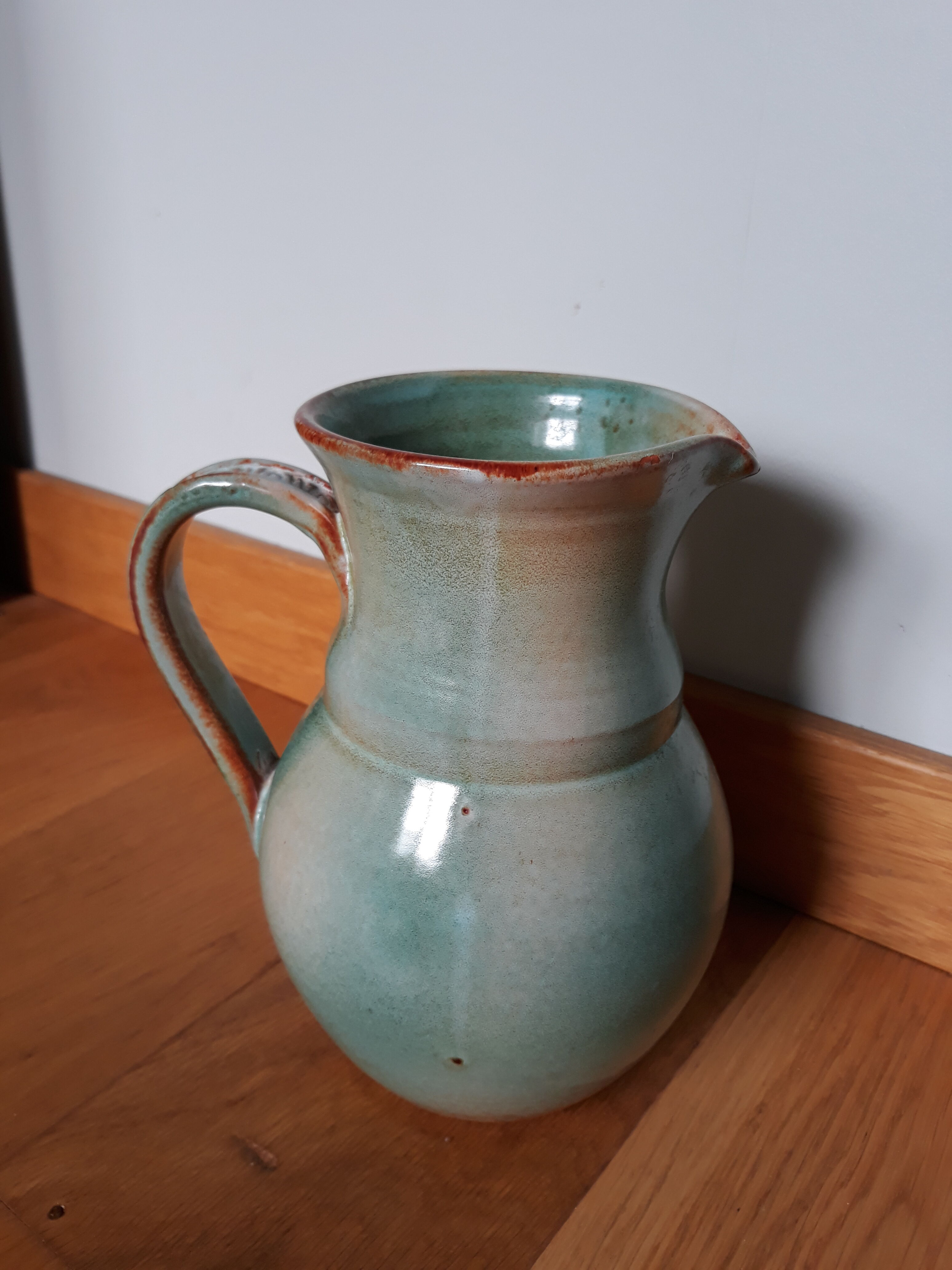 Pitcher with handle green celadon turquoise and caramel