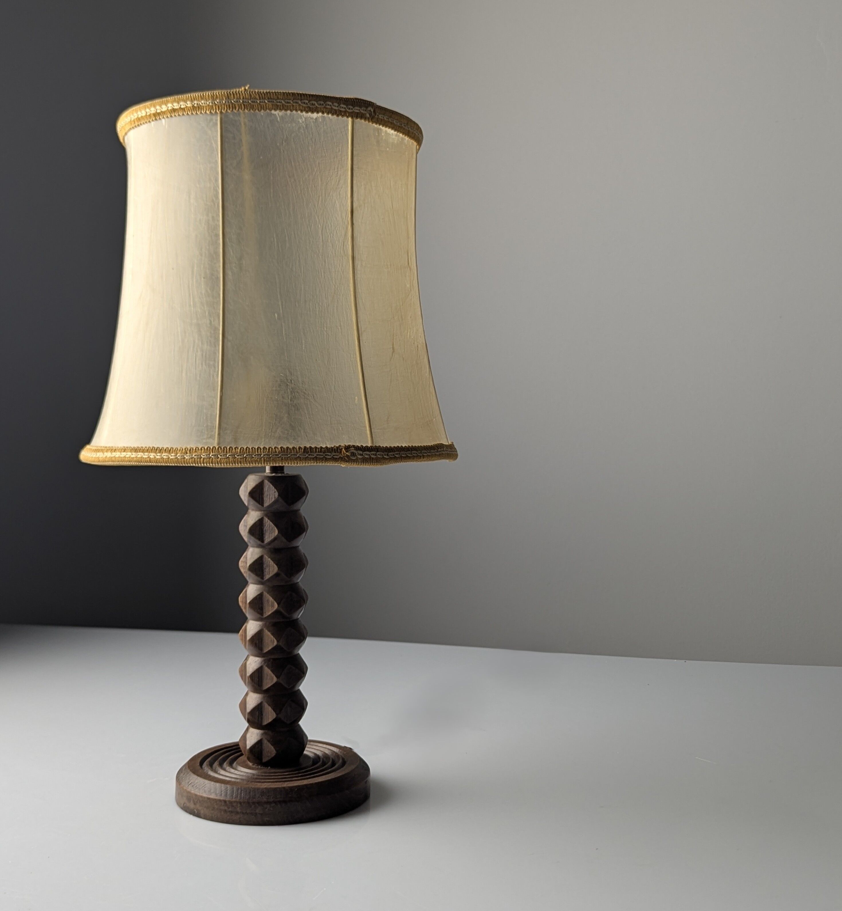 Charles Dudouyt oak table lamp with parchment shade, France, 1950s