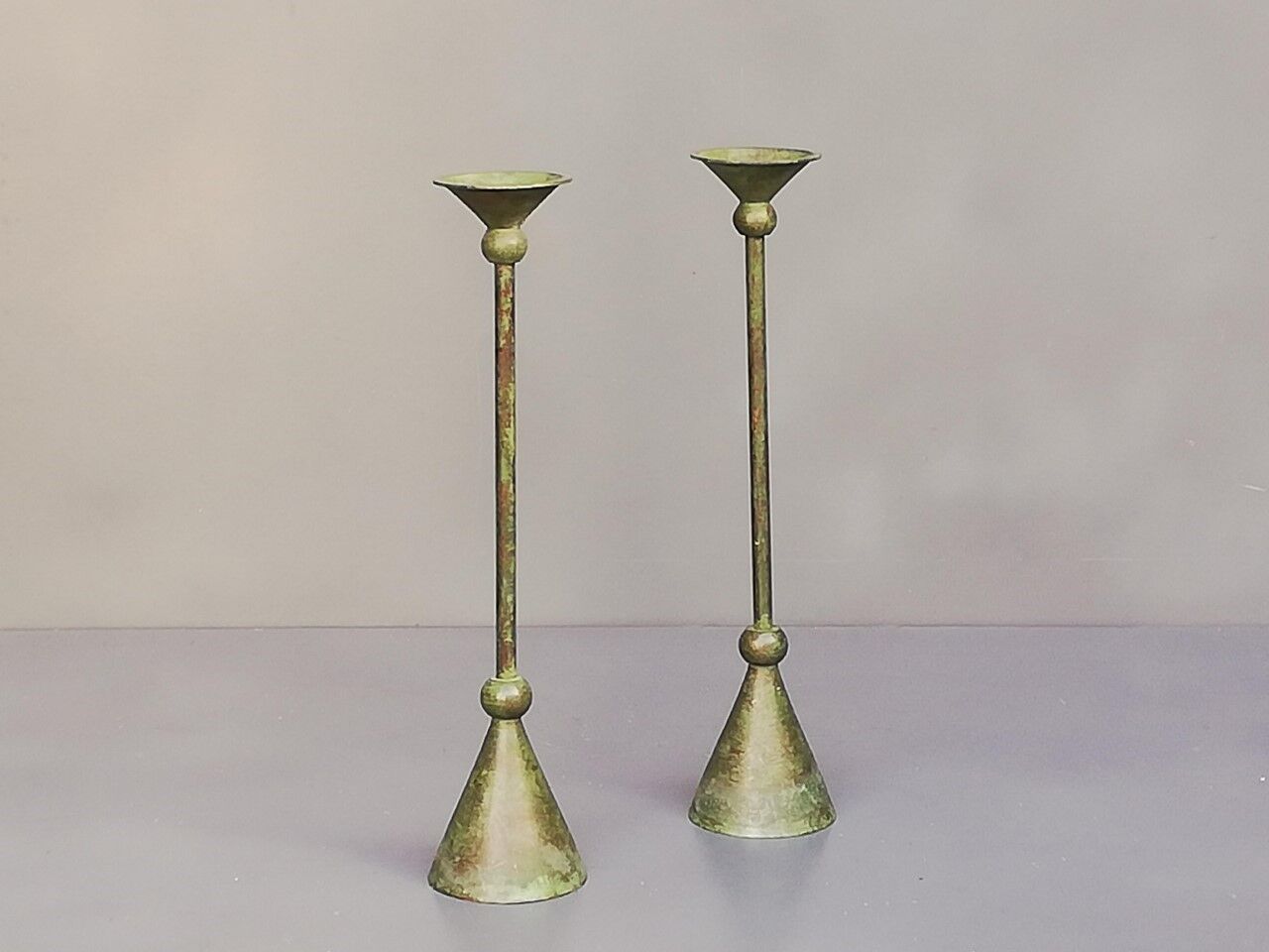 Pair of bronze patina metal candlesticks