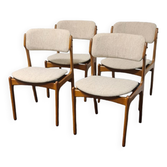 A set of four vintage teak dining chairs