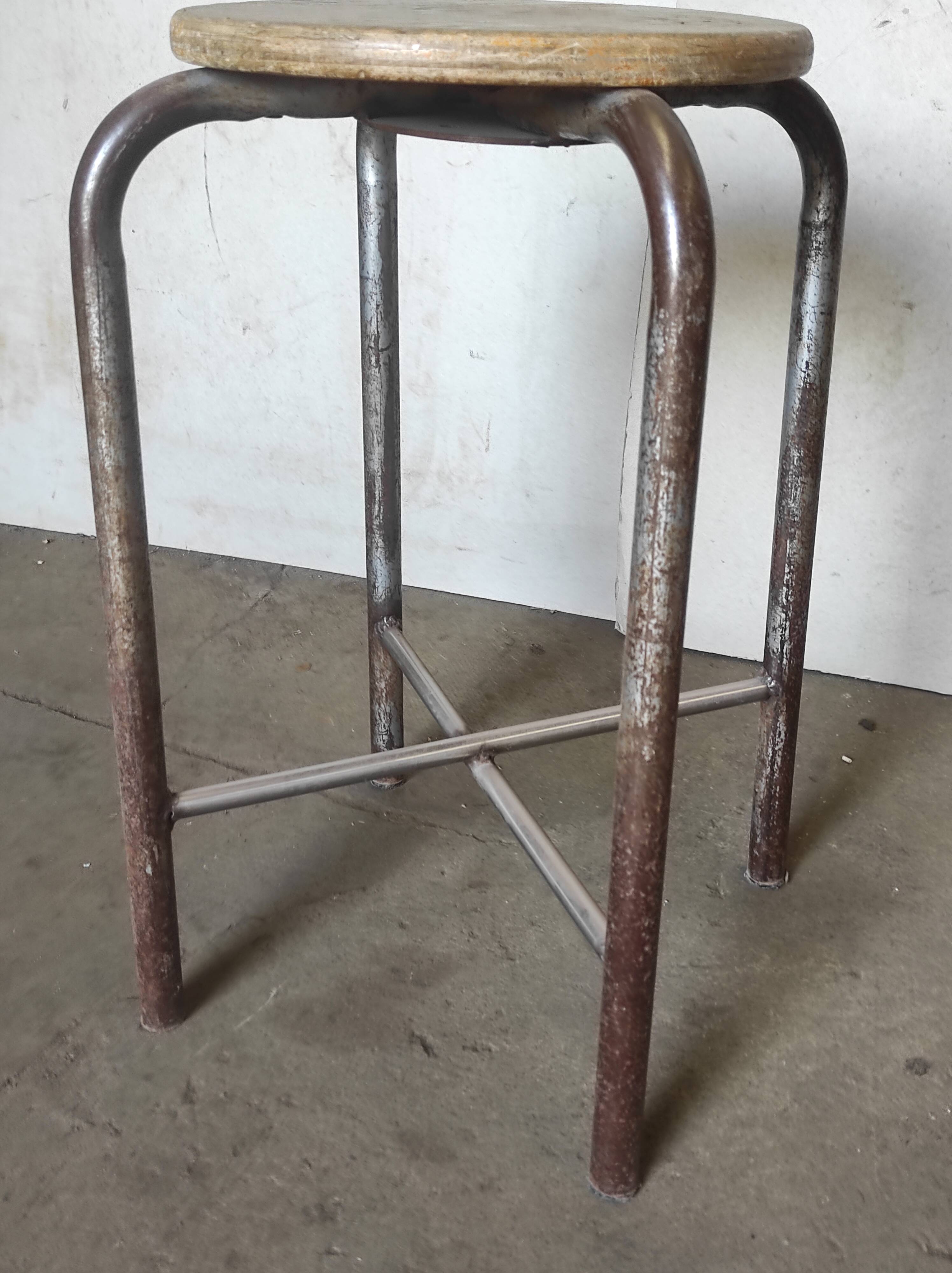 Old vintage metal and wood industrial workshop stool