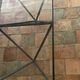 Design coffee table in glass and black metal – Geometric base