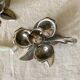Pair of silver metal flower candle holders