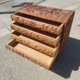 Compact 4-drawer ethnic chest of drawers carved with scenes of African life
