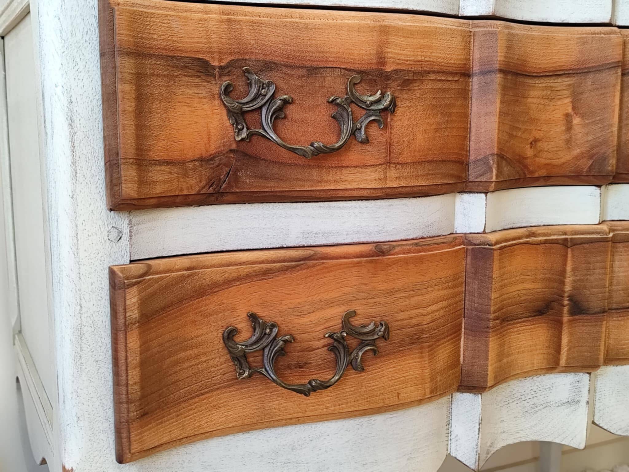 Walnut crossbow chest of drawers