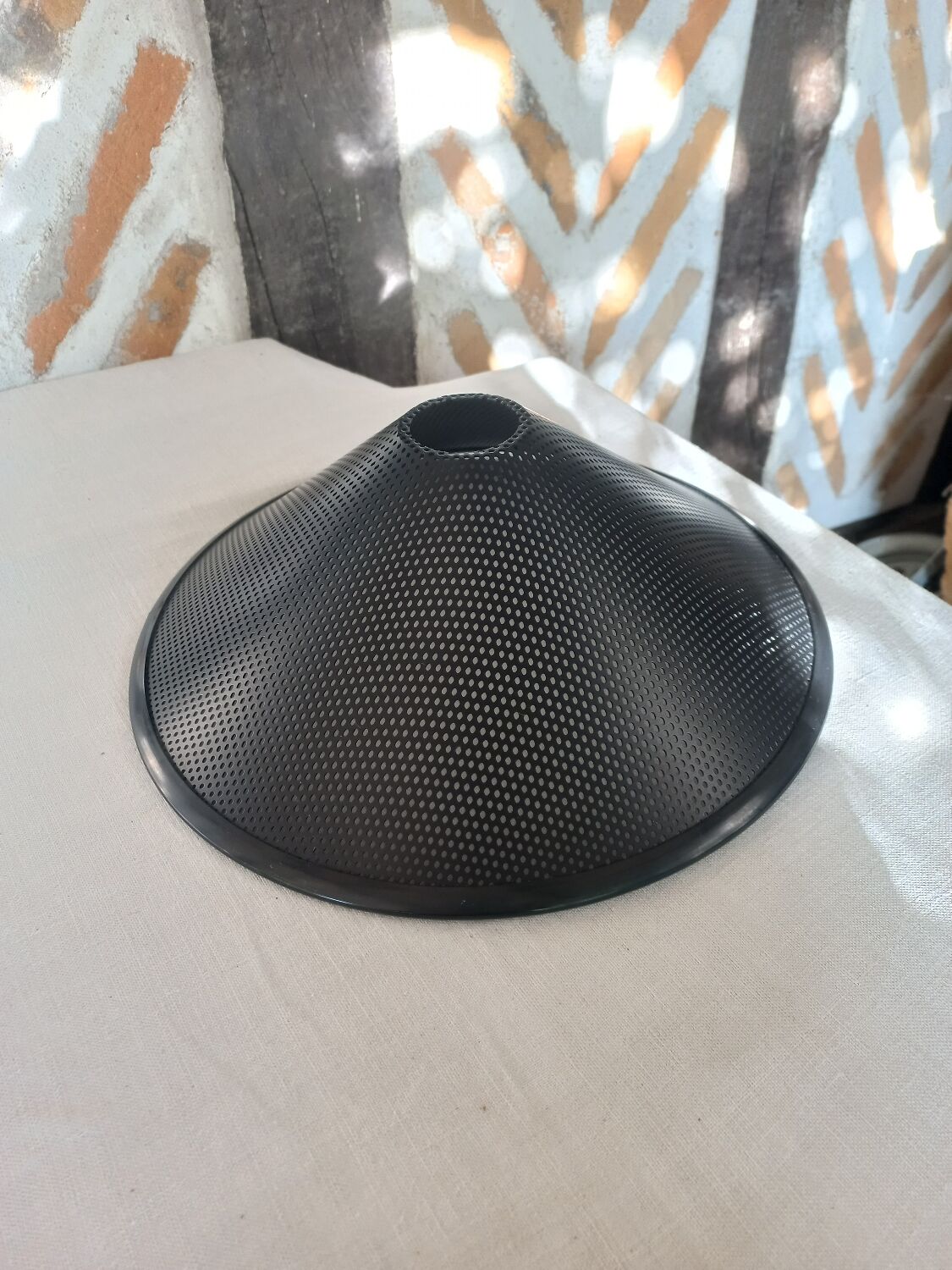 Black perforated metal day abatement