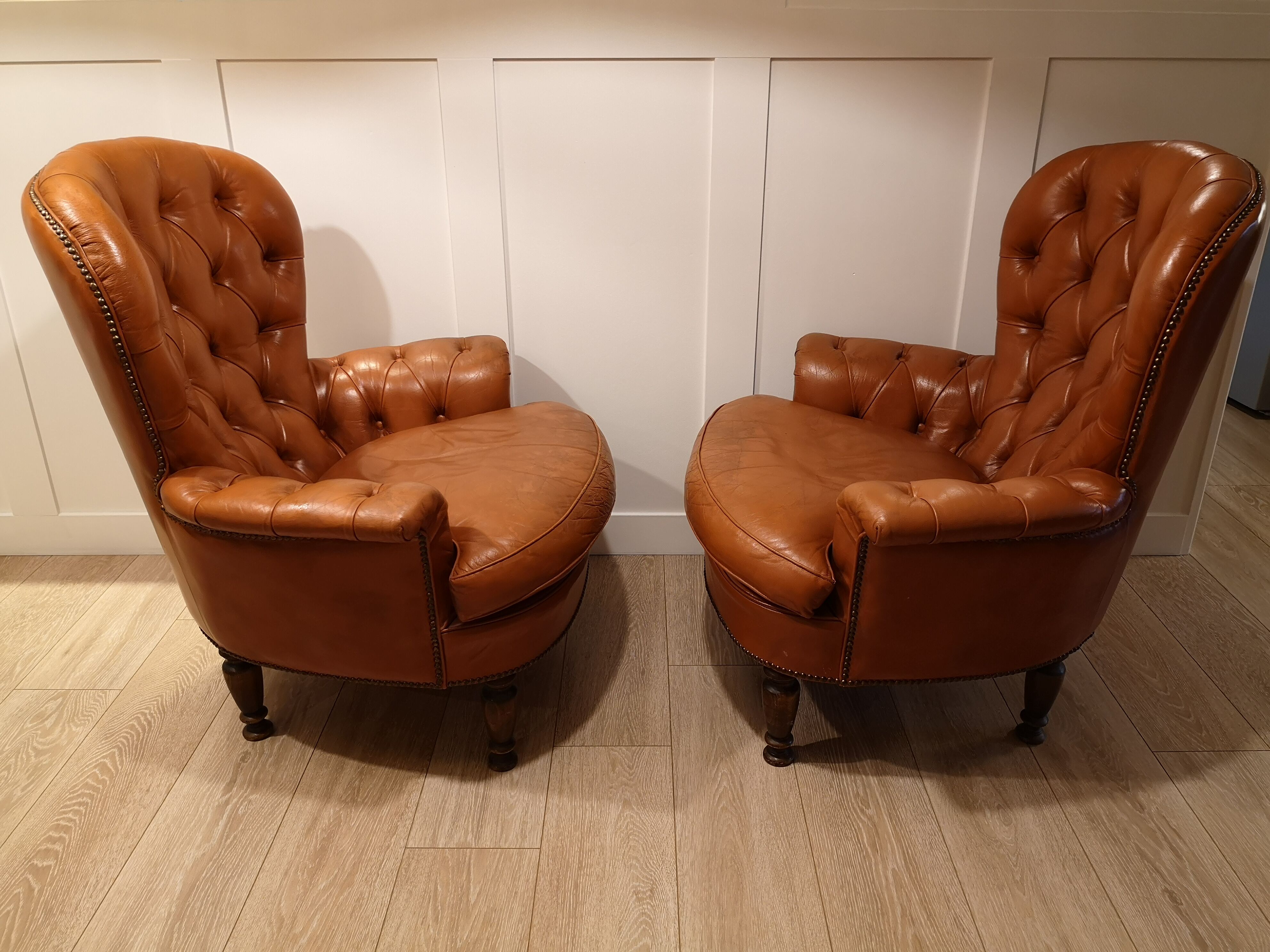 Pair of leather chesterfield chairs